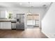 Bright kitchen features stainless steel appliances and access to outdoor deck through sliding glass door at 2005 Amos Oaks Ln, Charlotte, NC 28215