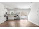 Bright kitchen featuring white cabinets, stainless steel appliances, and wood floors at 2005 Amos Oaks Ln, Charlotte, NC 28215