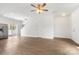 Spacious living room featuring wood floors, white walls, and open access to the kitchen at 2005 Amos Oaks Ln, Charlotte, NC 28215