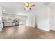 Open-concept living area with wood floors and neutral walls leading into a modern kitchen at 2005 Amos Oaks Ln, Charlotte, NC 28215