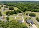 Scenic aerial view captures the beauty of a home surrounded by lush greenery and the serenity of the neighborhood at 203 Poplins Grove Church Rd, Albemarle, NC 28001
