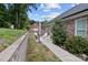 Scenic backyard view with a well-manicured lawn and cozy seating area, perfect for outdoor gatherings at 203 Poplins Grove Church Rd, Albemarle, NC 28001