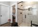 Elegant bathroom shower featuring tiled walls, glass door, and modern fixtures at 203 Poplins Grove Church Rd, Albemarle, NC 28001