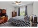 Cozy bedroom featuring natural light, neutral walls, and a ceiling fan at 203 Poplins Grove Church Rd, Albemarle, NC 28001