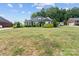 Charming home with lush landscaping, blooming plants, and a well-maintained front yard, offering curb appeal at 203 Poplins Grove Church Rd, Albemarle, NC 28001