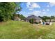 Spacious home with a well-manicured lawn and large backyard, offering ample space and outdoor enjoyment at 203 Poplins Grove Church Rd, Albemarle, NC 28001