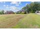 Beautiful home with a spacious front yard and manicured lawn, offering a serene and inviting atmosphere at 203 Poplins Grove Church Rd, Albemarle, NC 28001
