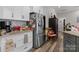Modern kitchen with stainless steel appliances and white cabinets, providing a clean look at 203 Poplins Grove Church Rd, Albemarle, NC 28001
