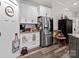Charming kitchen featuring stainless steel refrigerator and subway tile backsplash at 203 Poplins Grove Church Rd, Albemarle, NC 28001