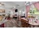 Inviting living room with a fireplace, dining area, large window, and comfortable seating at 203 Poplins Grove Church Rd, Albemarle, NC 28001