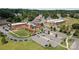 Aerial view of a commercial building with ample parking and attractive landscaping on a sunny day at 205 Church St, Mcadenville, NC 28101