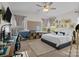 Bright bedroom with large windows, and a workspace with desk, chair and shelving at 205 Church St, Mcadenville, NC 28101