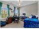 Bright bedroom with a desk, bookshelves, and a window overlooking the yard at 205 Church St, Mcadenville, NC 28101