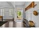 Elegant foyer with wainscoting, dark wood floors, and a view to the front yard at 205 Church St, Mcadenville, NC 28101