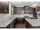 Modern kitchen features granite countertops, dark cabinets, and stainless steel appliances at 205 Church St, Mcadenville, NC 28101