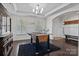 Recreation room with coffered ceiling, foosball table, and lots of natural light at 205 Church St, Mcadenville, NC 28101