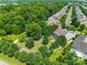 Aerial view of a residential property featuring a spacious backyard, mature trees, and a fenced-in yard at 2090 Durand Rd, Fort Mill, SC 29715