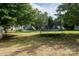 Large backyard features a trampoline and plenty of green space for outdoor activities at 2090 Durand Rd, Fort Mill, SC 29715
