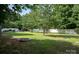 Spacious backyard features a fire pit, trampoline, and plenty of room to play and relax at 2090 Durand Rd, Fort Mill, SC 29715