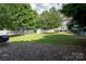 Expansive backyard with volleyball net, trampoline, and patio, ideal for entertaining and Gathering fun at 2090 Durand Rd, Fort Mill, SC 29715