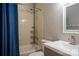 Well-lit bathroom with modern sink, tub, shower, and blue shower curtain at 2090 Durand Rd, Fort Mill, SC 29715