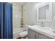 Well-lit bathroom featuring a shower-tub combination, toilet, sink and vanity, and a large mirror at 2090 Durand Rd, Fort Mill, SC 29715