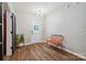 Bright entryway with hardwood floors, modern lighting, and a pop of color from the red bench at 2090 Durand Rd, Fort Mill, SC 29715