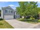 Charming two-story home with a well-maintained lawn, a two-car garage, and inviting curb appeal at 2090 Durand Rd, Fort Mill, SC 29715