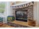 Close up of a charming stone fireplace with decorative accents and neutral colors at 2090 Durand Rd, Fort Mill, SC 29715