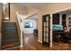 Open foyer with hardwood floors, staircase, and a view into the dining and living areas at 2090 Durand Rd, Fort Mill, SC 29715