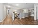 Upstairs hallway with hardwood-style floors, security gate, and built-in bookshelf at 2090 Durand Rd, Fort Mill, SC 29715