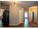 Spacious hallway with hardwood floors, neutral walls, and access to multiple rooms at 2090 Durand Rd, Fort Mill, SC 29715