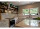 Modern kitchen with white cabinets, herringbone backsplash, stainless steel appliances, and hardwood floors at 2090 Durand Rd, Fort Mill, SC 29715