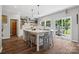 Bright kitchen with a large island, modern appliances, hardwood floors, and sliding glass doors at 2090 Durand Rd, Fort Mill, SC 29715