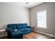 Comfortable living room featuring a large blue couch and hardwood flooring at 2090 Durand Rd, Fort Mill, SC 29715