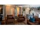 Comfortable living room featuring leather furniture and an open floor plan leading to the kitchen at 2090 Durand Rd, Fort Mill, SC 29715