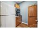 This kitchen includes a pantry with brown cabinets, a microwave, and a white refrigerator at 2090 Durand Rd, Fort Mill, SC 29715