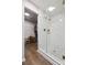 Walk-in shower featuring herringbone tile surround and glass enclosure at 2090 Durand Rd, Fort Mill, SC 29715