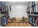 Spacious walk-in closet features ample shelving, hanging space, and wood-look floors for optimal organization at 2090 Durand Rd, Fort Mill, SC 29715
