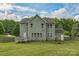 Spacious backyard featuring lush lawn, privacy fence, and mature trees at 2100 Darian Way, Waxhaw, NC 28173