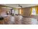 Spacious bonus room showcasing hard wood floors, ample natural light, and versatile layout at 2100 Darian Way, Waxhaw, NC 28173