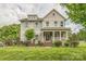 Charming two-story home with inviting front porch and manicured landscaping at 2100 Darian Way, Waxhaw, NC 28173