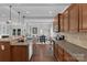 Open kitchen featuring granite counters, stainless steel appliances, and a view into the breakfast area at 2100 Darian Way, Waxhaw, NC 28173