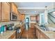 Well-appointed kitchen with stainless steel appliances, granite counters, and ample cabinet space at 2100 Darian Way, Waxhaw, NC 28173