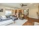 Cozy living room showcasing an open floor plan with hardwood floors and a comfortable gray sectional sofa at 2100 Darian Way, Waxhaw, NC 28173