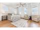 Bright bedroom features hardwood floors, ceiling fan, plantation shutters, and stylish decor at 2523 Irwin Stream Rd, Charlotte, NC 28208