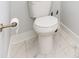 Close-up of a modern white toilet with bronze fixtures and marble tile at 2523 Irwin Stream Rd, Charlotte, NC 28208