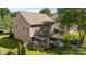 Aerial view showcases backyard with patio, pergola, outdoor kitchen, dining set, and manicured lawn at 3006 S Legacy Park Blvd, Indian Land, SC 29707