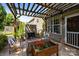 Inviting backyard featuring a pergola, stone fireplace, outdoor seating and mature trees for shade at 3006 S Legacy Park Blvd, Indian Land, SC 29707