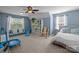 Bright bedroom with large windows, comfortable seating, and play area for children at 3006 S Legacy Park Blvd, Indian Land, SC 29707